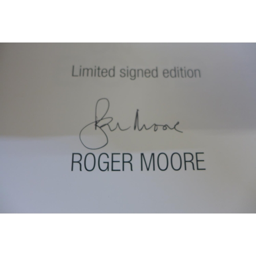 720 - A 'Bond on Bond' limited edition book, signd by Roger Moore plus two other James Bond related books