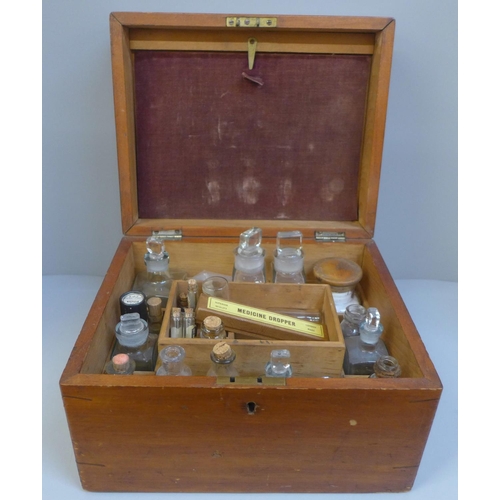 723 - A wooden apocathery box with bottles