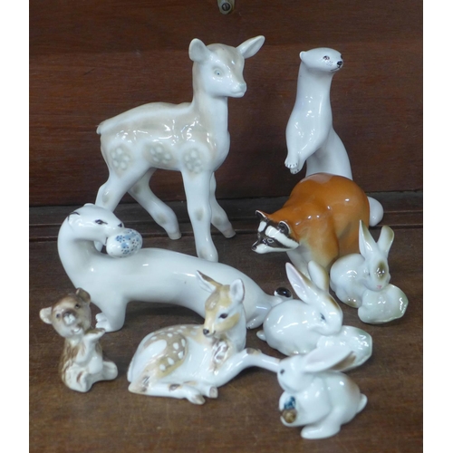 732 - A collection of Russian porcelain animal figures including fawn, mink and raccoon