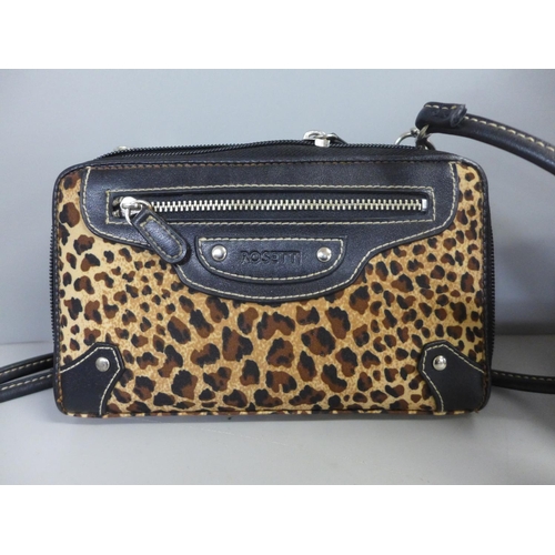 775 - A Rosetti leopard print clutch bag and a leather handbag