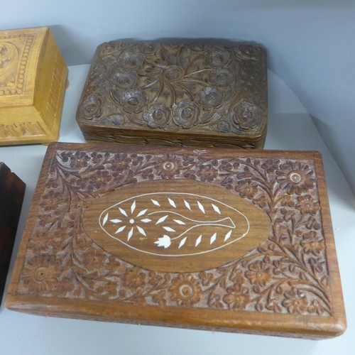 780 - A collection of eight carved wooden boxes