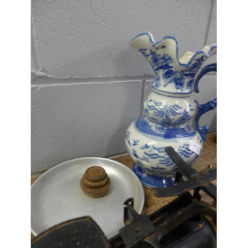 826 - A Chinese jug, a set of scales with weights and a blow torch