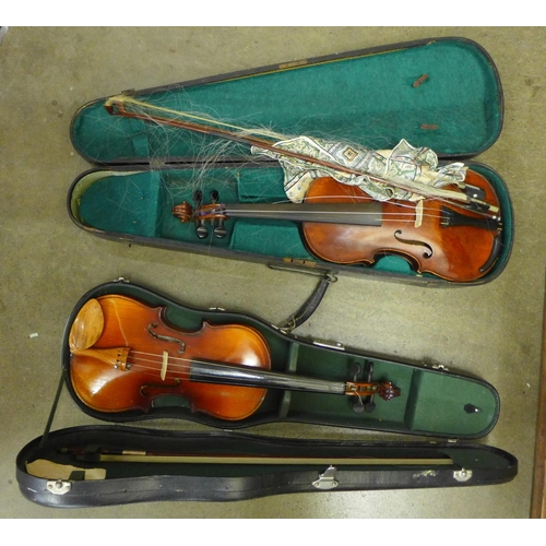 838 - Two violins; one Chinese, length of back 34cm and the other with no identifying label, length of bac... 