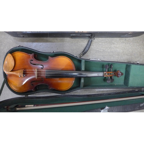 838 - Two violins; one Chinese, length of back 34cm and the other with no identifying label, length of bac... 