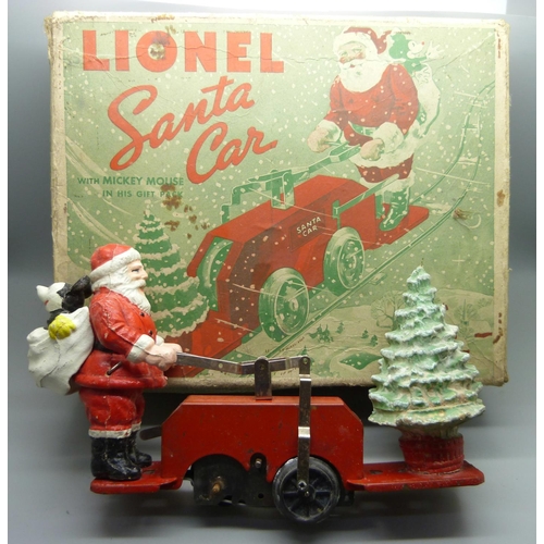 843 - A Lionel Santa car with Mickey Mouse, one wheel loose, boxed