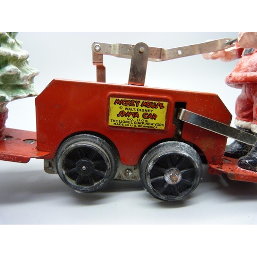 843 - A Lionel Santa car with Mickey Mouse, one wheel loose, boxed