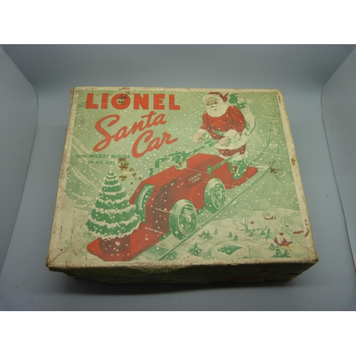 843 - A Lionel Santa car with Mickey Mouse, one wheel loose, boxed