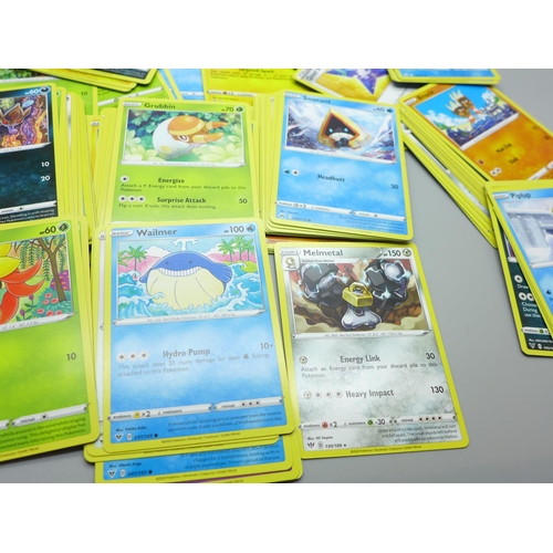 844 - Thirty Holo/reverse Holo and 300 common/uncommon/rare Pokemon cards in tin