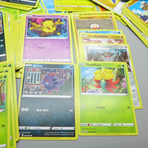 844 - Thirty Holo/reverse Holo and 300 common/uncommon/rare Pokemon cards in tin