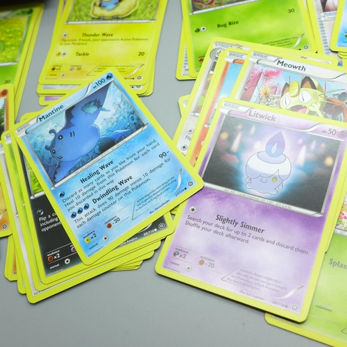 847 - Thirty Holo/reverse Holo and 300 common/uncommon/rare Pokemon cards, in tin