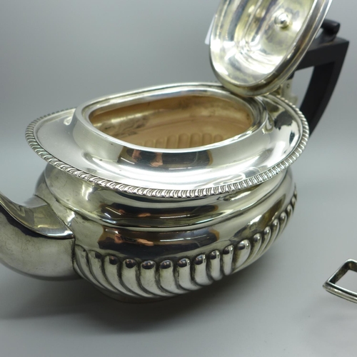 860 - A silver tea pot and a silver cream jug, 768g gross weight