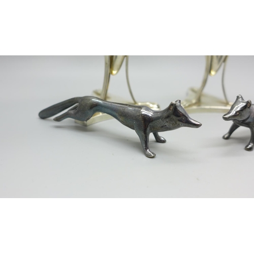 864 - A pair of WMF vases and a pair of WMF knife rests in the form of foxes