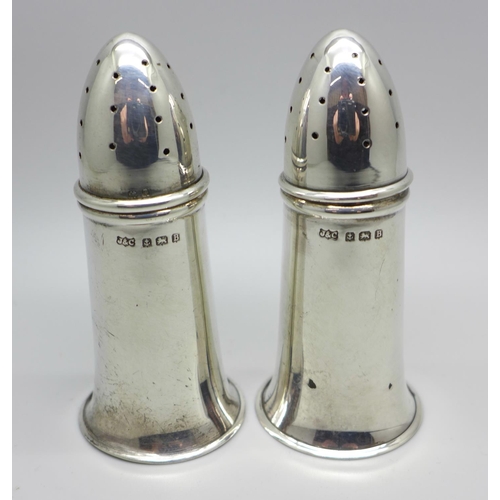 873 - A pair of novelty silver pepper pots in the form of bullets, Birmingham 1926, 51g