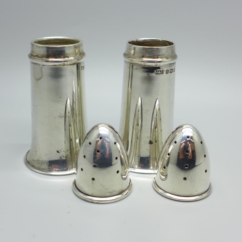 873 - A pair of novelty silver pepper pots in the form of bullets, Birmingham 1926, 51g