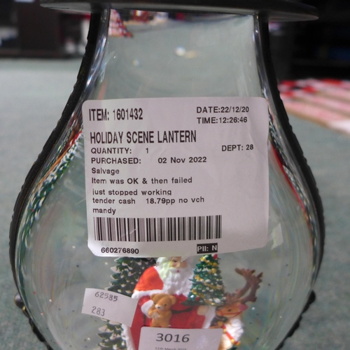 3016 - Holiday Scene Lantern and a So Long Hot Water Bottle (2ltr)(283-32,34) * This lot is subject to VAT