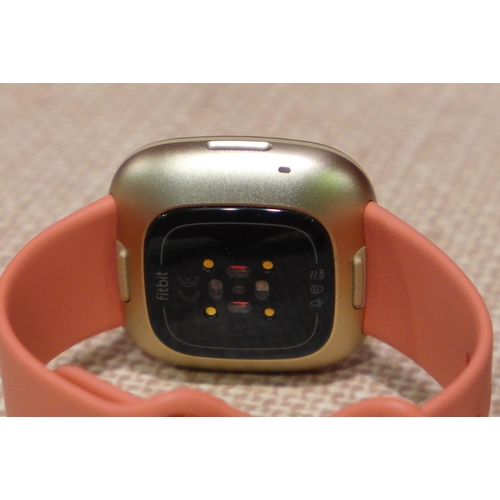 3084 - Fitbit Versa 3 - Pink/Gold, original RRP £124.99 + VAT (283-41) * This lot is subject to VAT