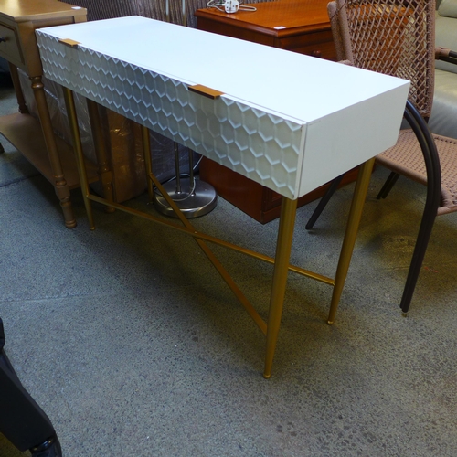 1661 - A white console table with gold legs