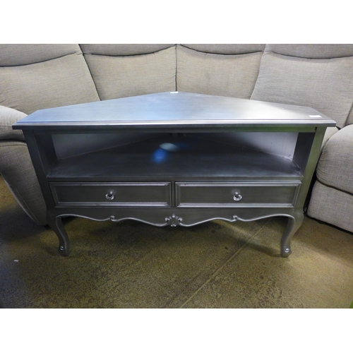 1678 - A silver two drawer corner media unit