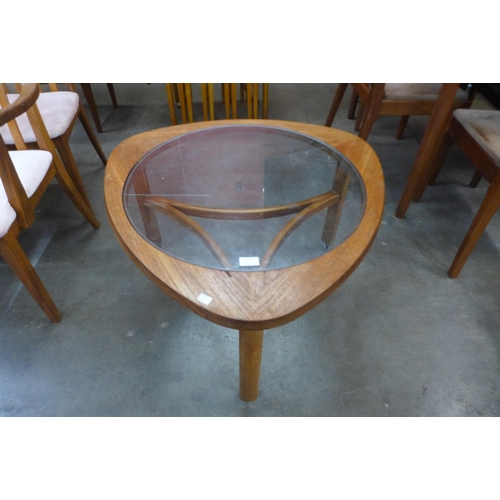 11 - A Nathan teak and glass topped triangular coffee table