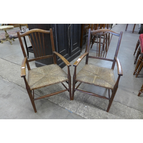 119 - A pair of child's Arts and Crafts mahogany rush seated chairs