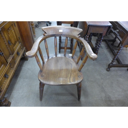 123 - A Victorian elm and beech smokers bow chair