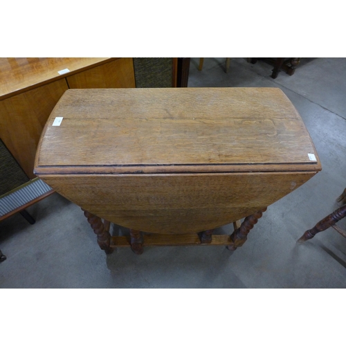 128 - An oak barleytwist gateleg table