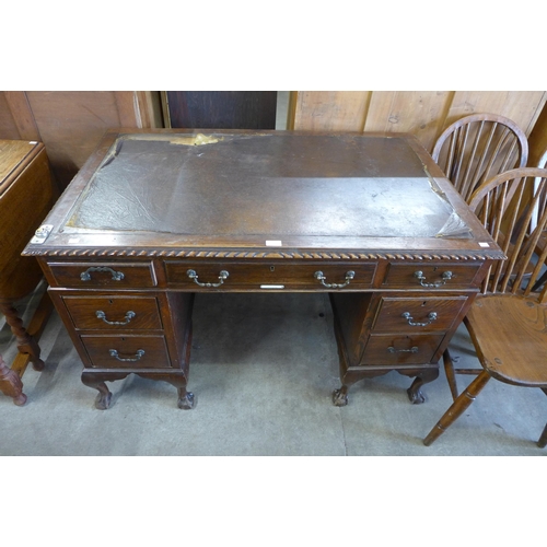 130 - An Edward VII Chippendale Revival carved mahogany pedestal desk