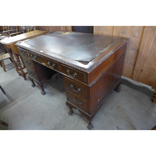 130 - An Edward VII Chippendale Revival carved mahogany pedestal desk