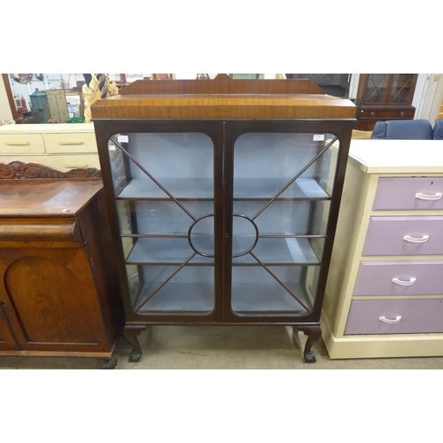 153 - An Art Deco mahogany two door display cabinet