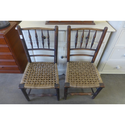 180 - A pair of Victorian elm spindleback kitchen chairs