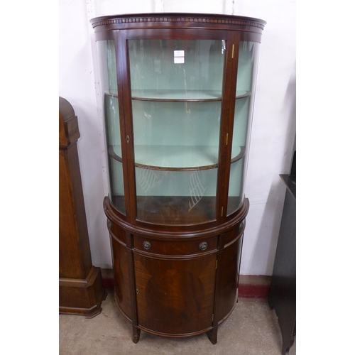 203 - A mahogany demi lune side cabinet