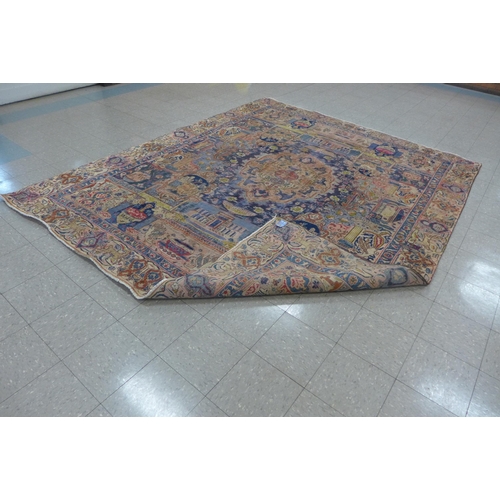 206 - A Persian cream and blue ground rug, 324 x 270cms, a/f