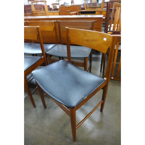 27 - A set of eight teak dining chairs