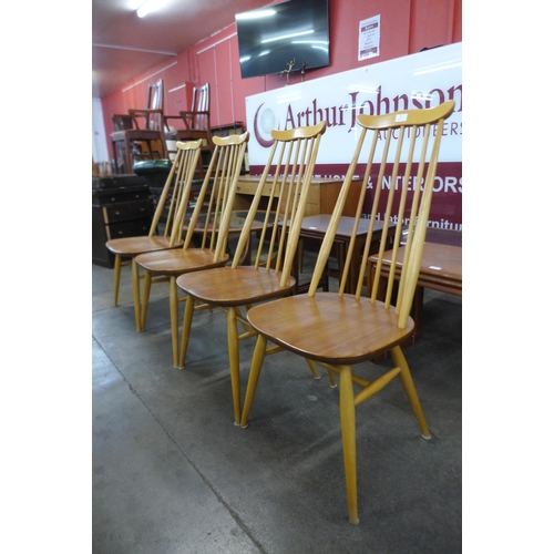 31 - A set of four Ercol Blonde elm and beech Goldsmith chairs