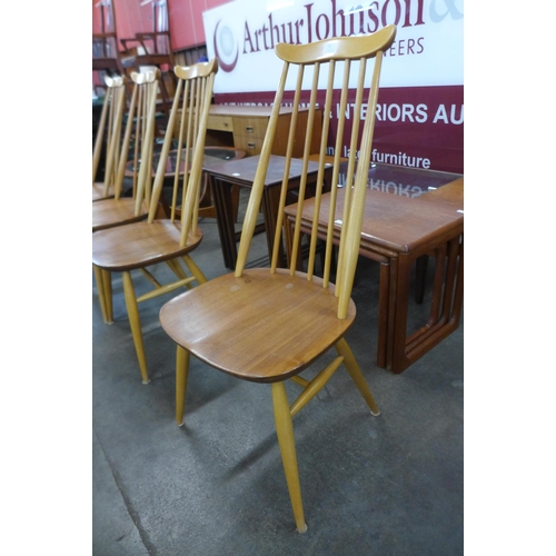 31 - A set of four Ercol Blonde elm and beech Goldsmith chairs