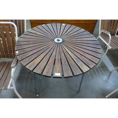 33 - A Danish Daneline teak and tubular steel circular garden table and four chairs