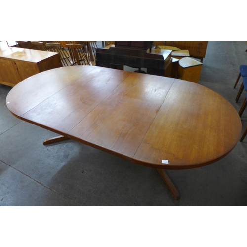 41 - A Danish teak extending dining table