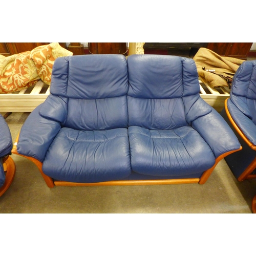 44 - A Norwegian Ekornes Stressless beech and blue leather five piece lounge suite, comprising; two sette... 