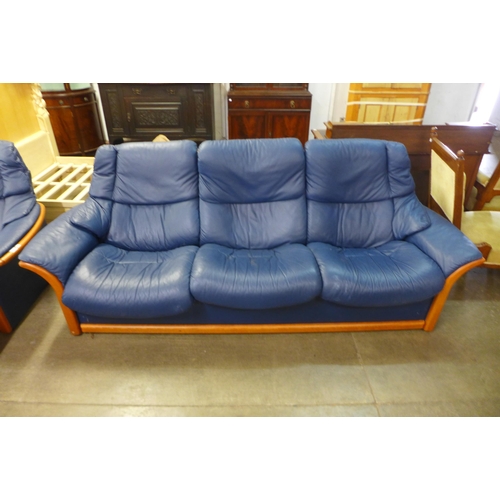 44 - A Norwegian Ekornes Stressless beech and blue leather five piece lounge suite, comprising; two sette... 