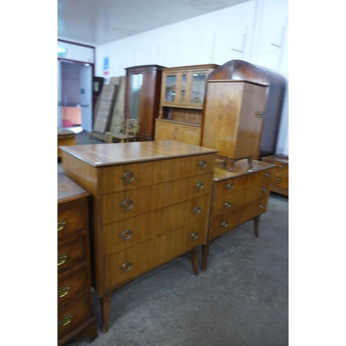 45 - An Afromosia three piece bedroom suite, comprising two chests of drawers and a pot cupboard