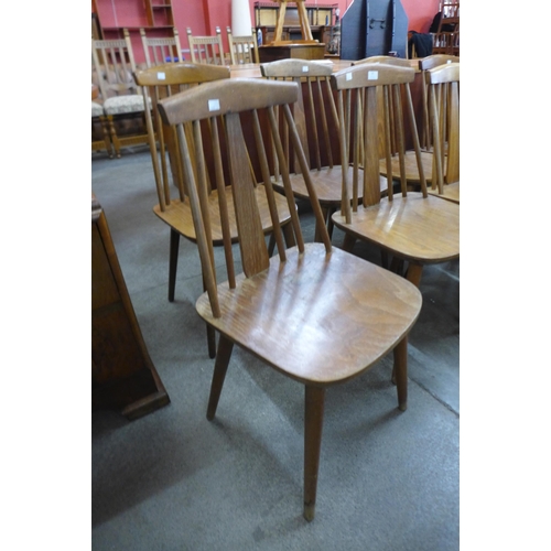 46 - A set of eight beech kitchen chairs