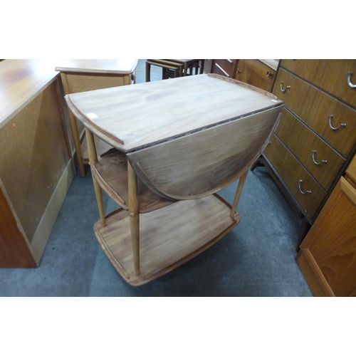 49 - An Ercol elm and beech Windsor drop-leaf trolley