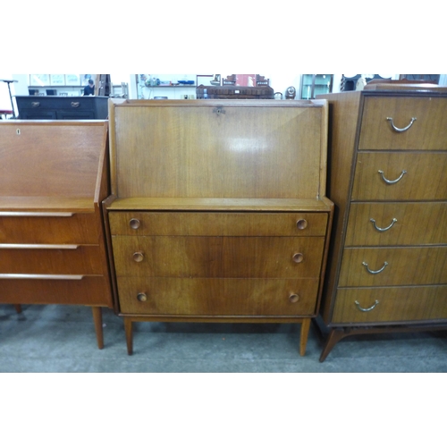 56 - A teak and walnut bureau