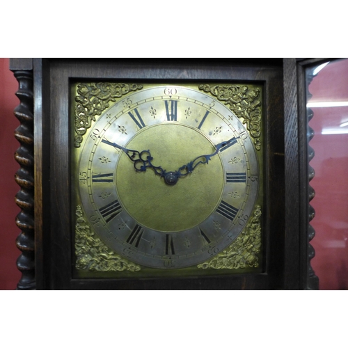 70 - An early 20th Century oak triple weight longcase clock