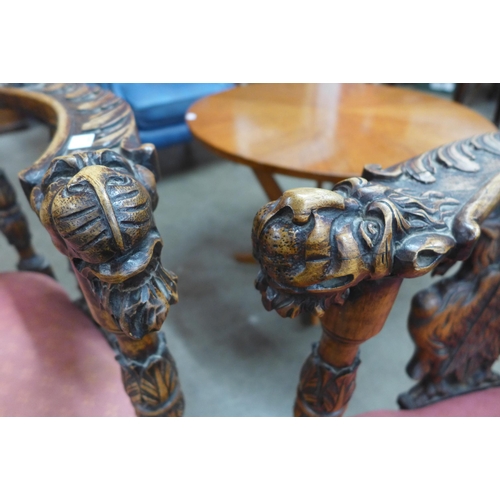 76 - A pair of Italian Baroque style carved corner chairs