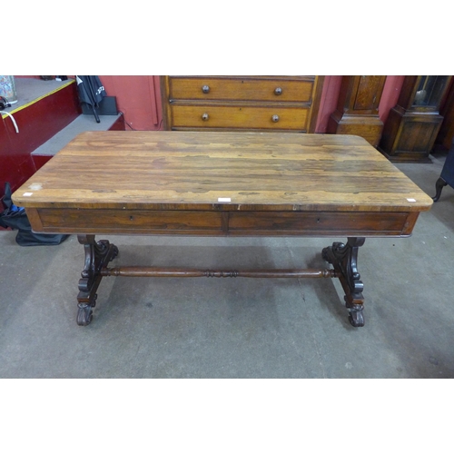 77 - A William IV rosewood two drawer library table