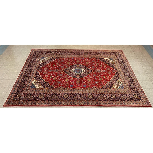 94 - A large Persian Kashan red ground rug, 349 x 249cms