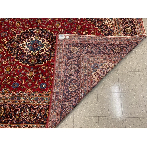 94 - A large Persian Kashan red ground rug, 349 x 249cms