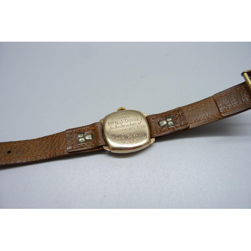 1010 - A 9ct gold cased Hefik wristwatch, with presentation inscription to case back