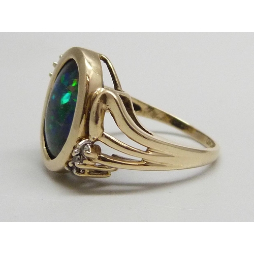 1016 - A 9ct gold ring with mosaic opal style inlay and six diamonds, 3.8g, N